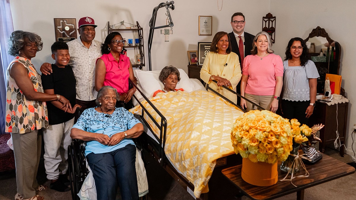 Ben Myers (pictured far right) of LongeviQuest, a global research organization that tracks human longevity, gathers with Elizabeth Francis' family members and presents her award as the oldest living American in the U.S.