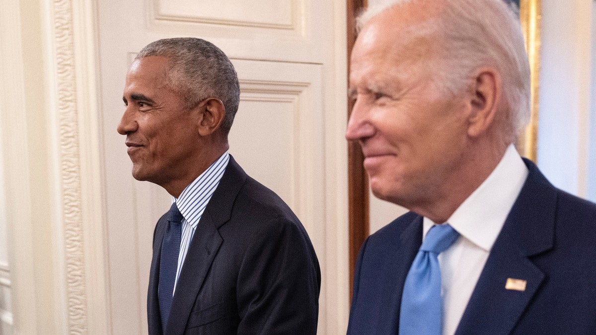 Barack Obama, left, with President Biden right