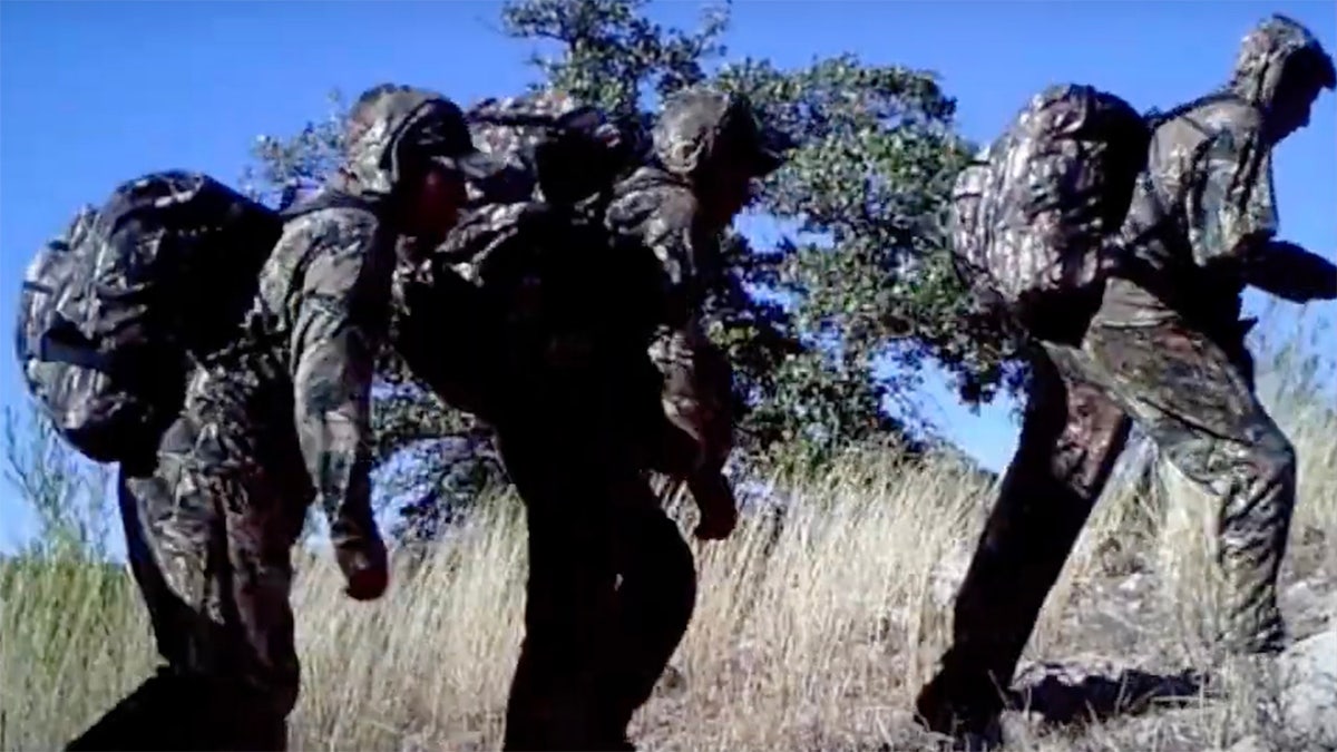 Camouflaged people sneaking onto an Arizona ranchers property