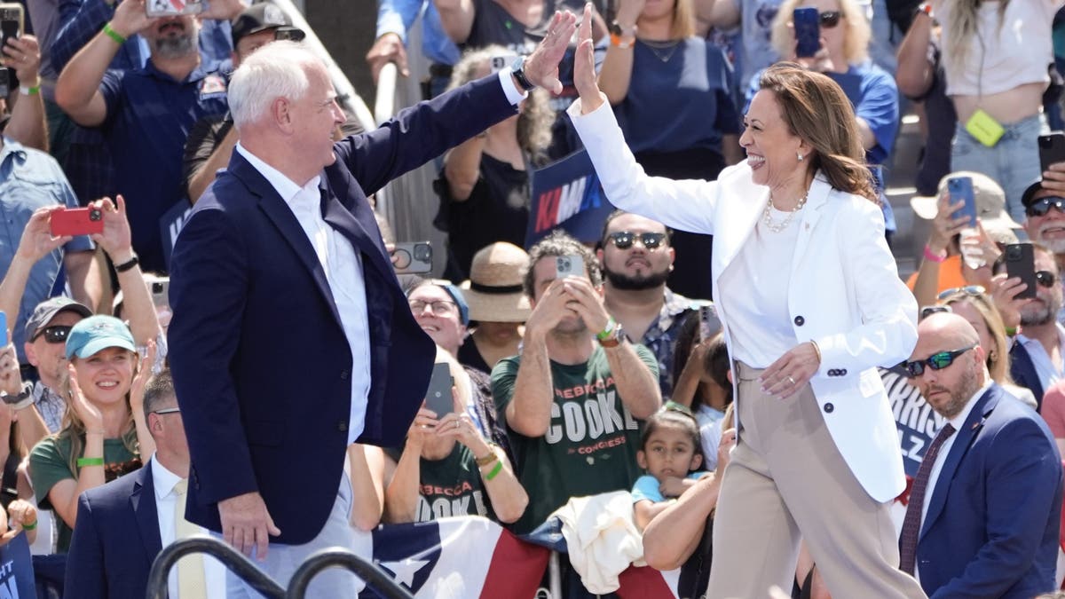 Democratic presidential nominee Vice President Kamala Harris is welcomed by Democratic vice presidential nominee Minnesota Gov. Tim Walz