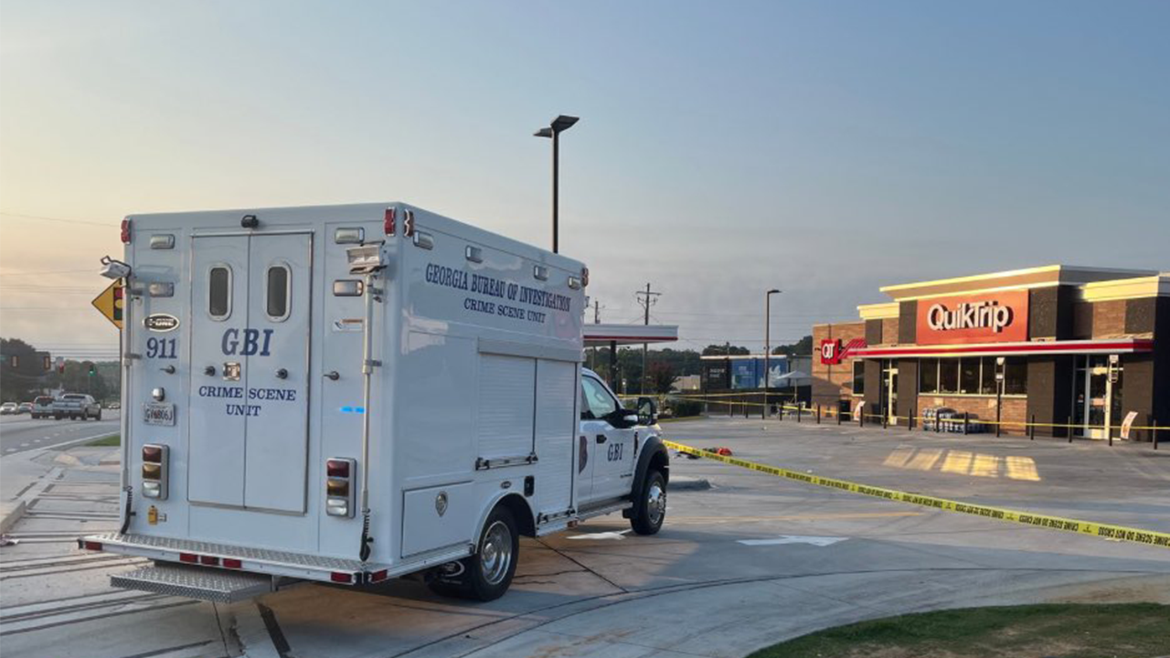 Georgia police fatally shoot man waving machine gun around near gas station