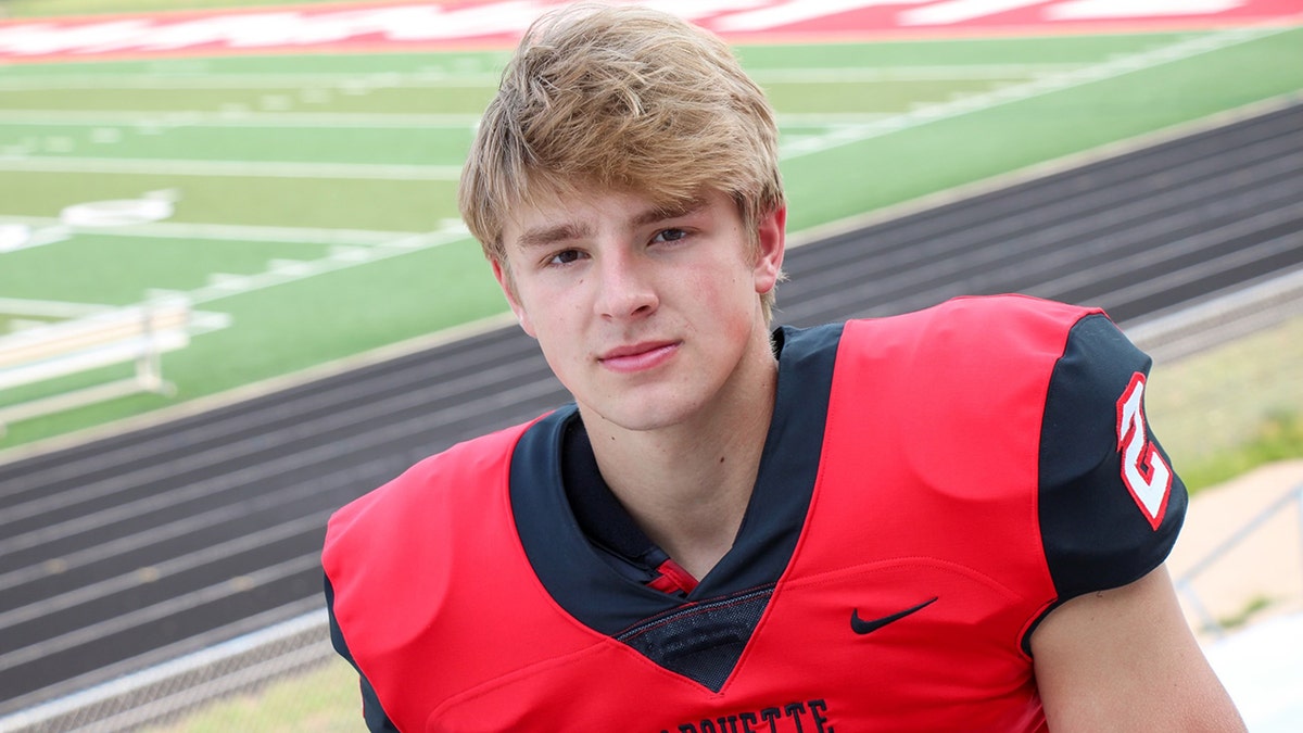 Jordan DeMay wearing a football jersey