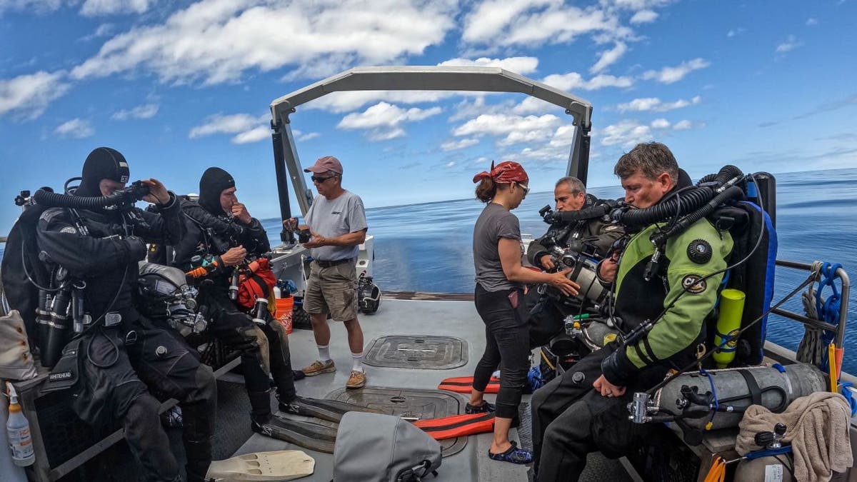 Researchers on boat