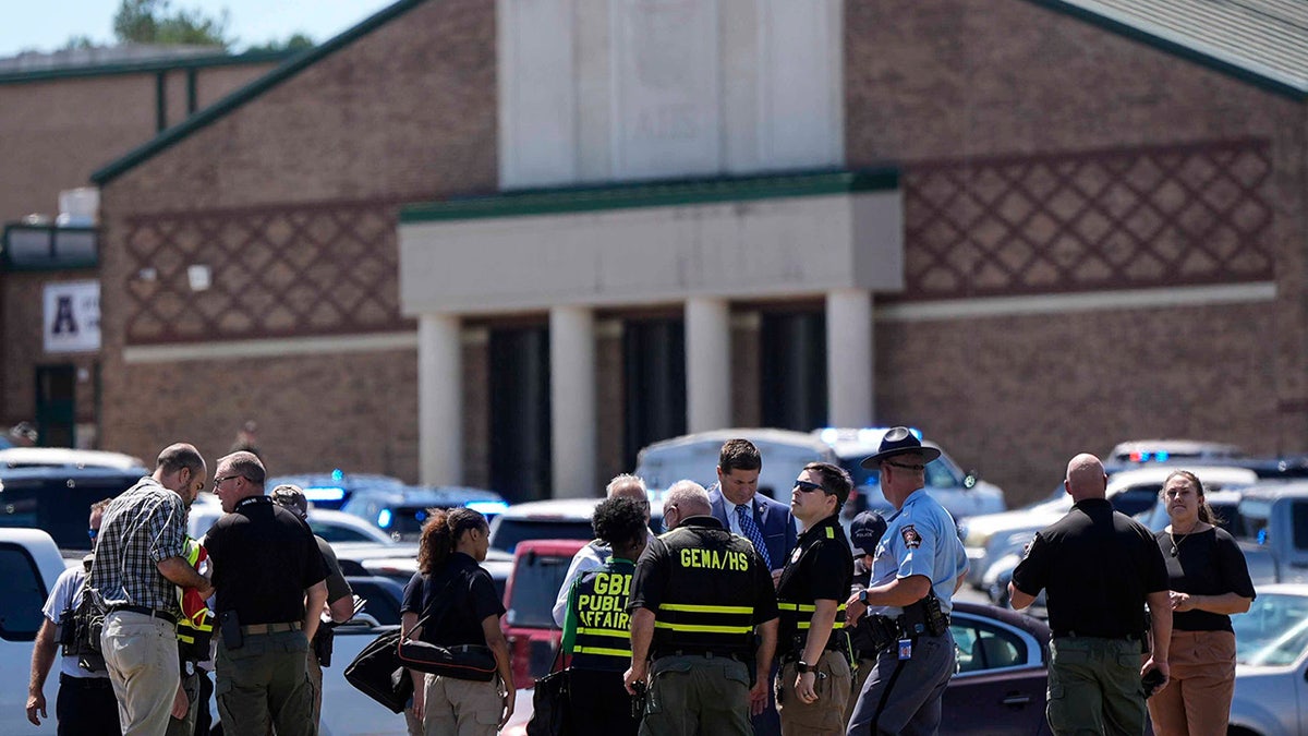 Police gather outside Apalachee High School after a shooting at the school