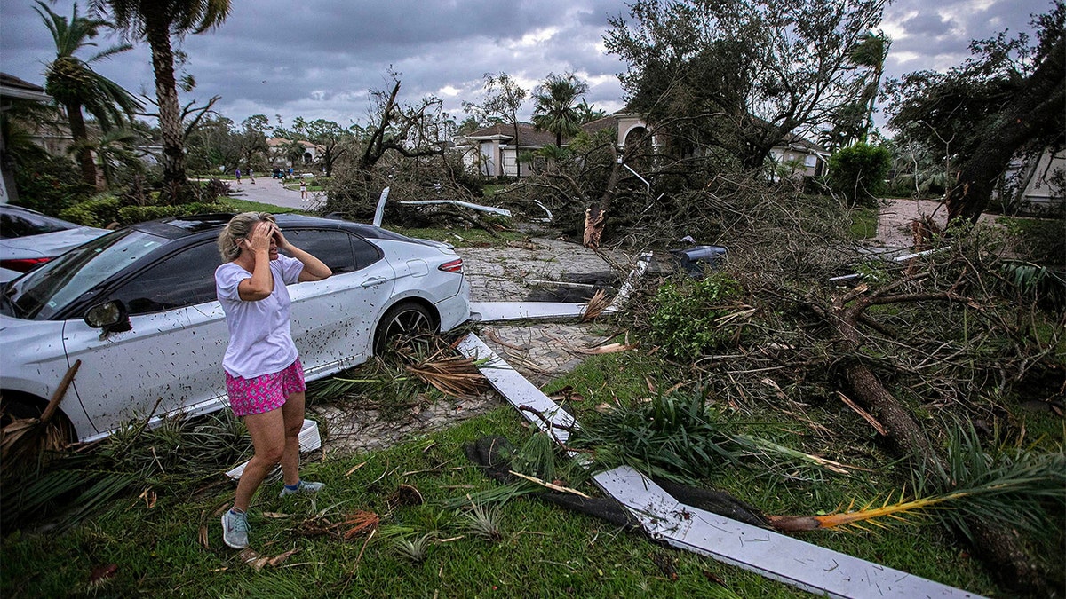 Woman reacting to damage.