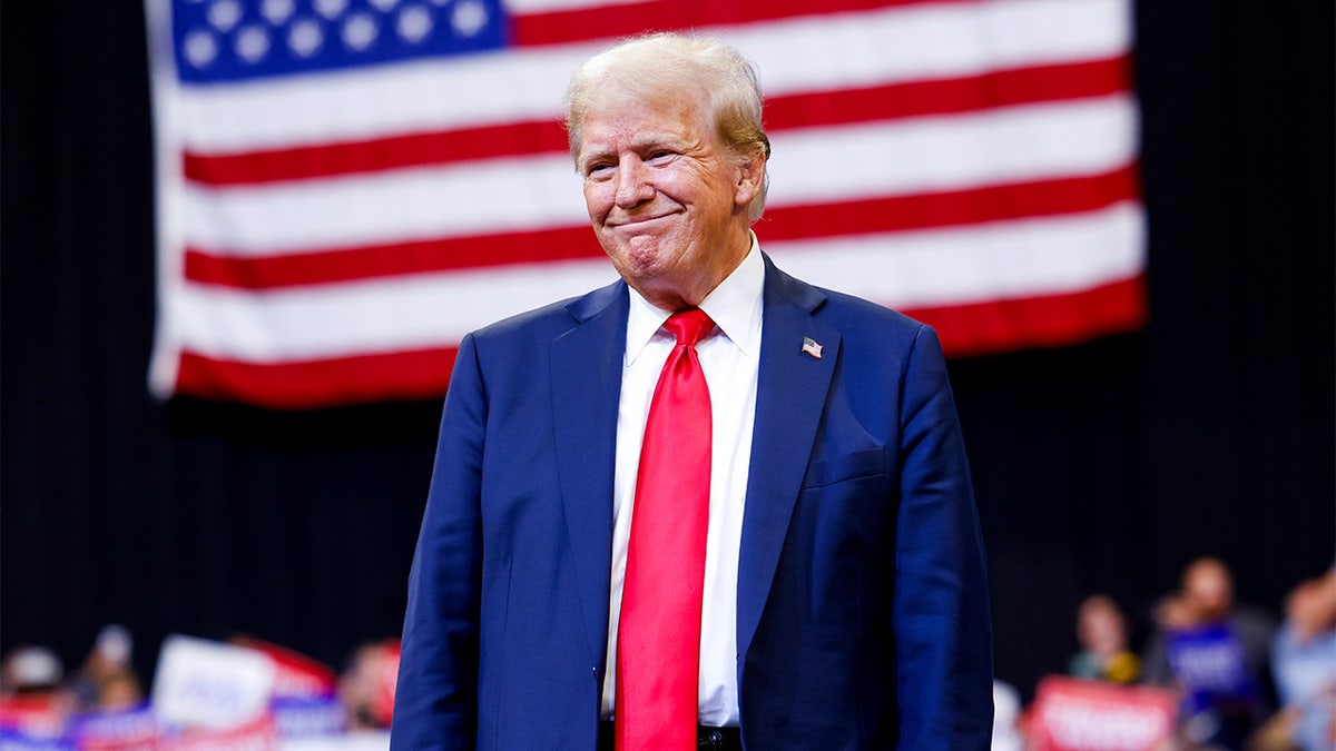 Trump in front of flag