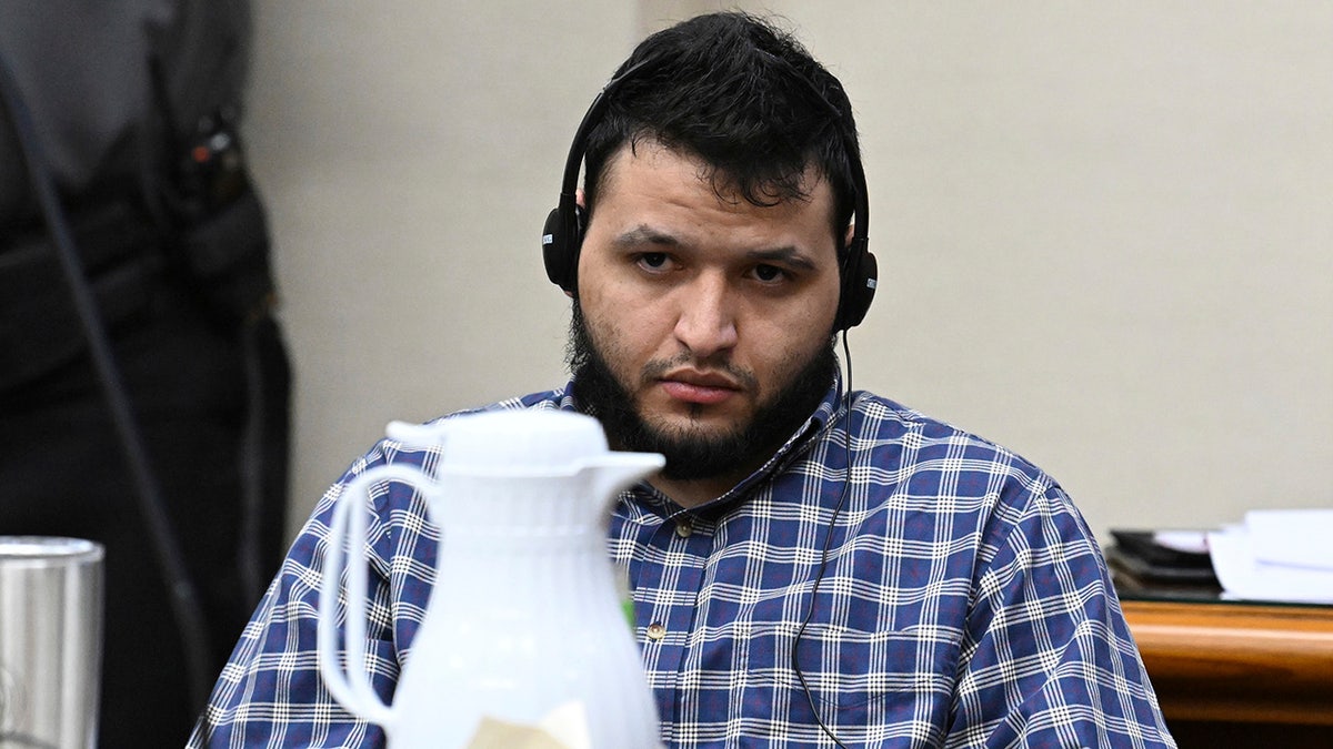 Jose Ibarra, accused of killing a Georgia nursing student earlier this year, listens through an interpreter during his trial