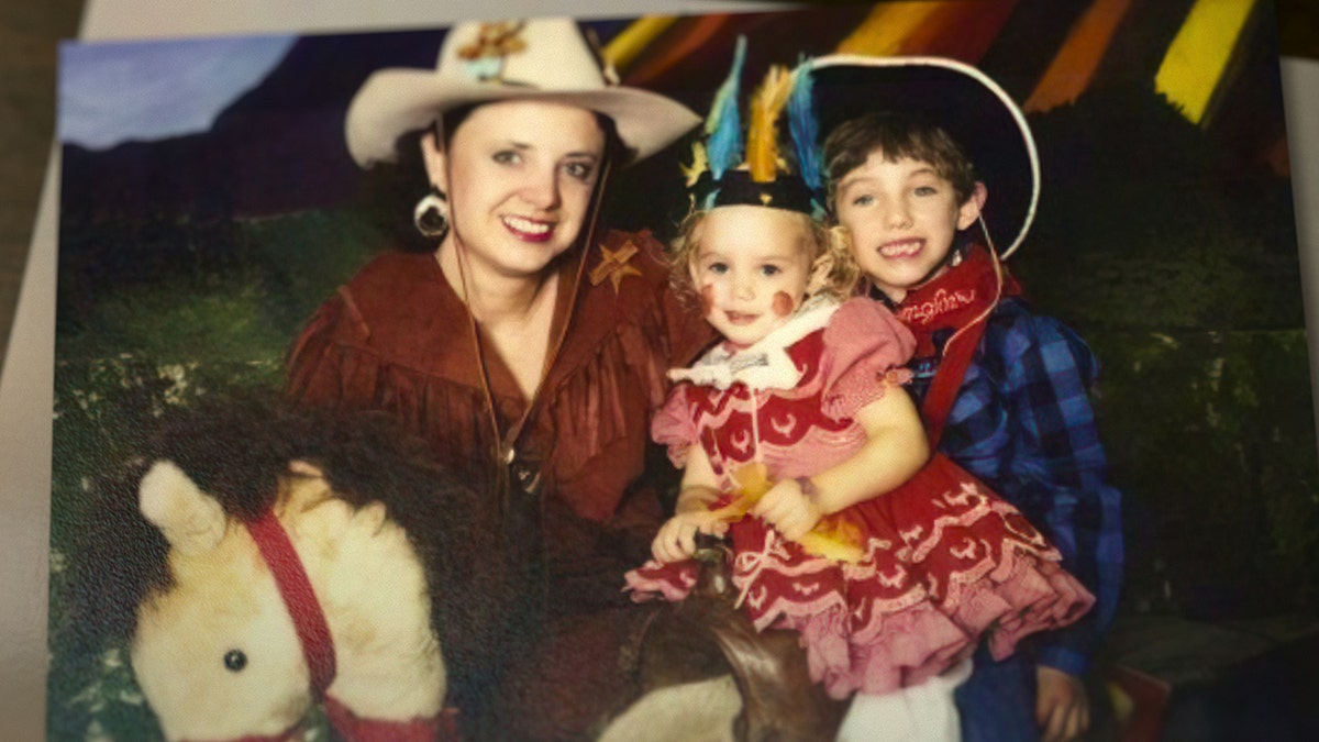 Patsy Ramsey with her two children in rodeo gear.