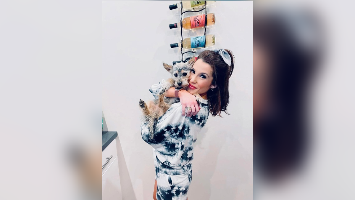 Ana Orsini holding a dog