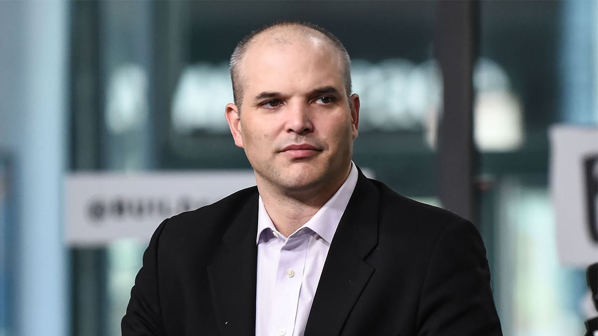 Matt Taibbi sits in chair during interview