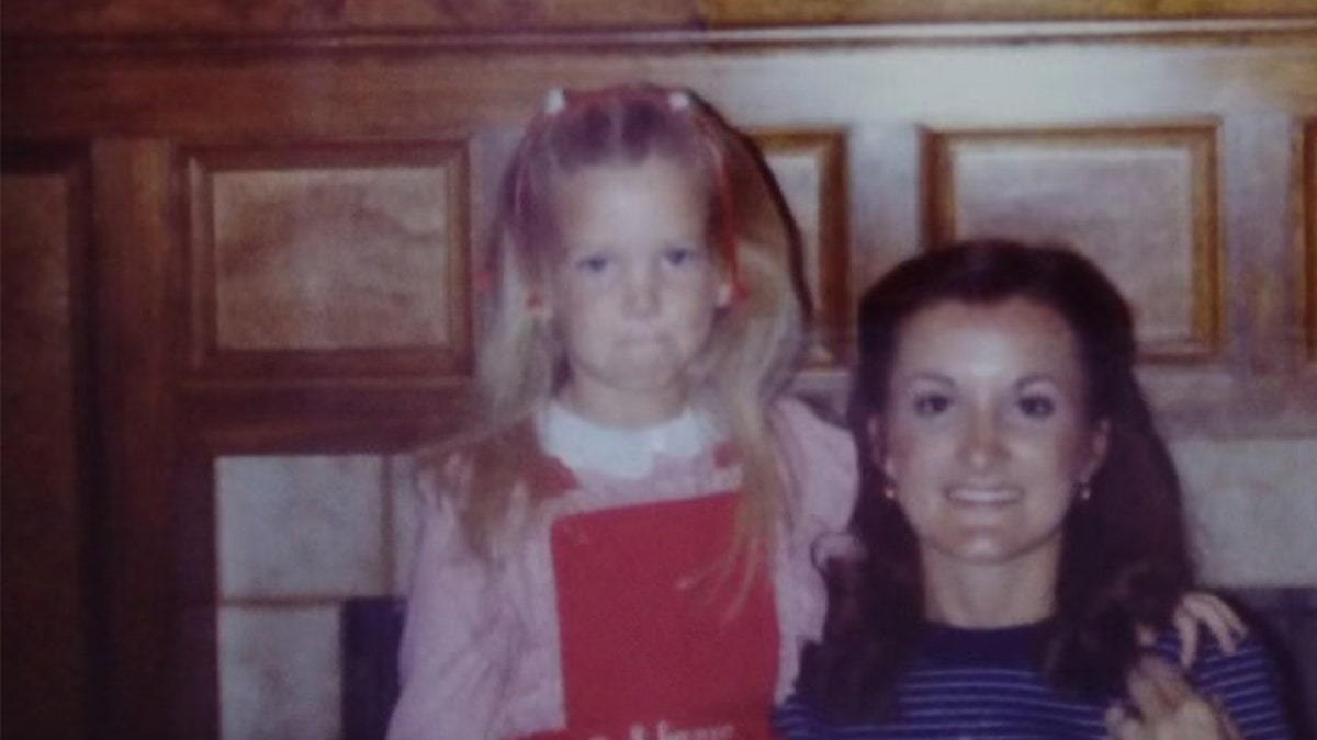 Shanna wearing a red dress next to her mother Wanda Holloway wearing a blue sweater.