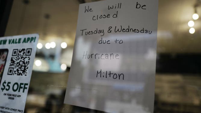 A sign alerts customers that a store will be closed as Hurricane Milton churns in the Gulf of Mexico on October 07, 2024 in Tampa, Florida.