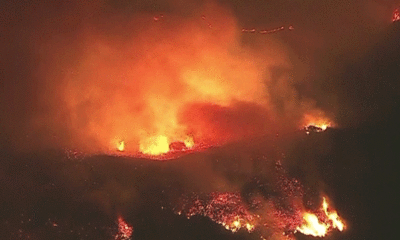 Firefighters struggle to contain fast-moving Malibu wildfire, prompting evacuation orders