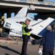 Aftermath of small plane crash onto Texas roadway caught on camera with split fuselage, damaged vehicles