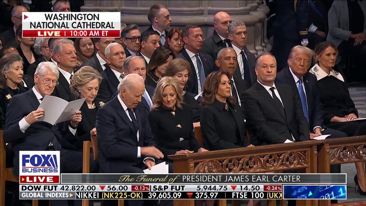 Joe Biden in front row, former presidents behind him