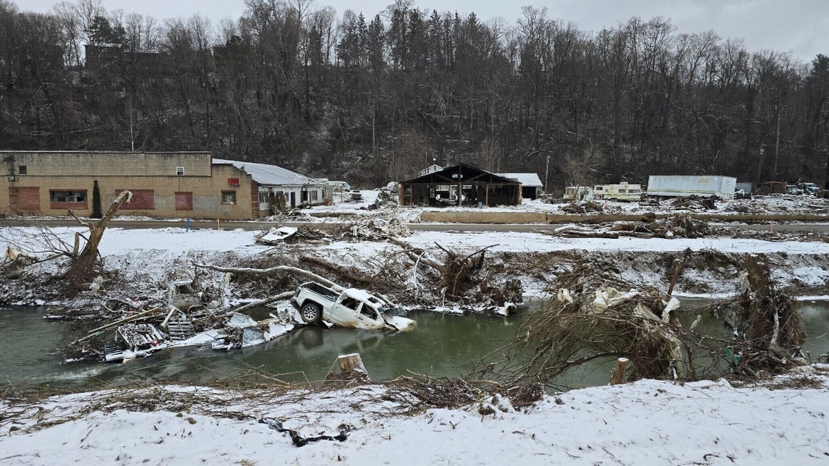 A section of Swannanoa, North Carolina, destroyed by Hurricane Helene is coated in snow.