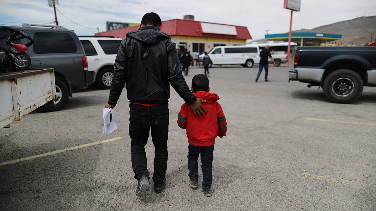 A migrant carries his paperwork after being dropped off at a church serving as a shelter for migrants who are seeking asylum, after they were released by the U.S. Immigration and Customs Enforcement on May 19, 2019 in El Paso, Texas.