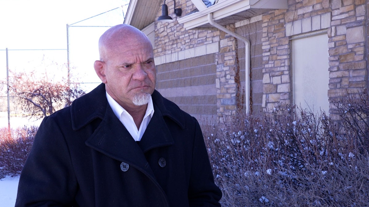 John Fabbricatore stands in Aurora park