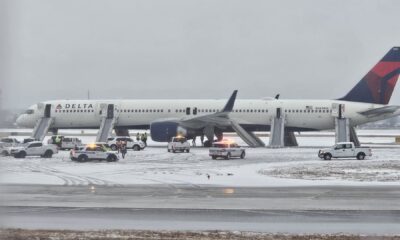 Delta passengers evacuate flight on emergency slides during aborted takeoff