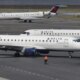 Delta plane wing clips runway during botched landing at LaGuardia Airport