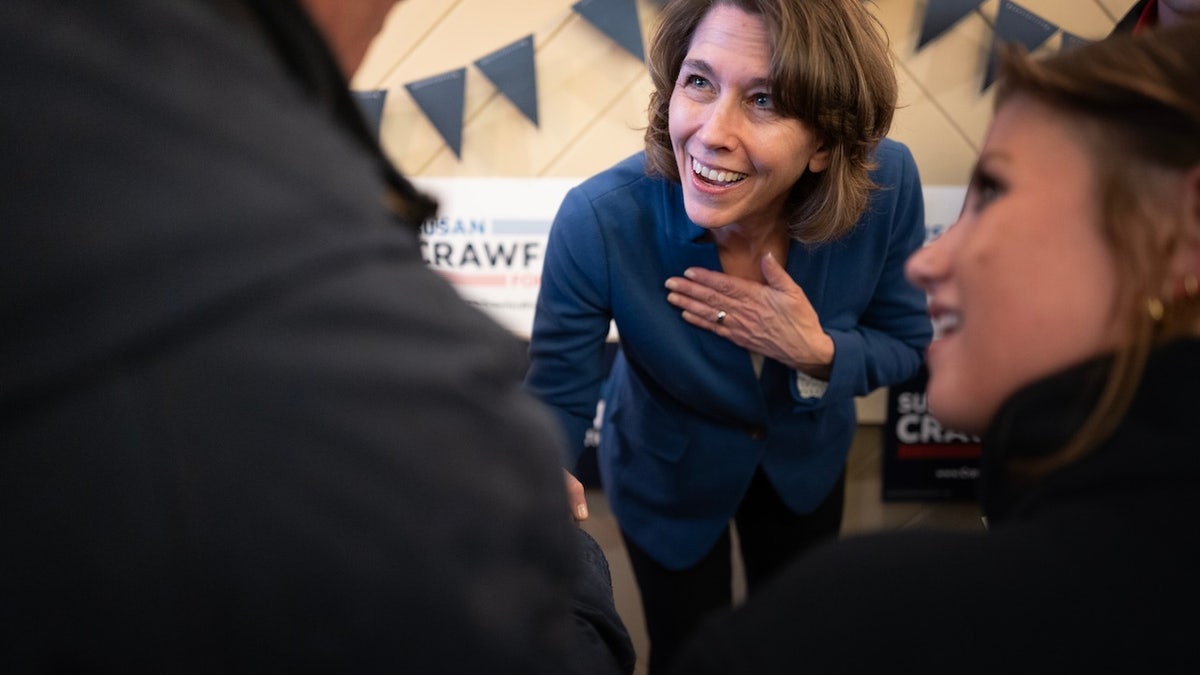 RACINE, WISCONSIN - MARCH 23: Judge Susan Crawford, candidate for the Wisconsin Supreme Court, greets supporters during a campaign stop at the Racine County Democratic Party headquarters on March 23, 2025 in Racine, Wisconsin. The former prosecutor is running against Judge Brad Schimel, who has been endorsed by President Donald Trump and financially supported by billionaire businessman Elon Musk. (Photo by Scott Olson/Getty Images)