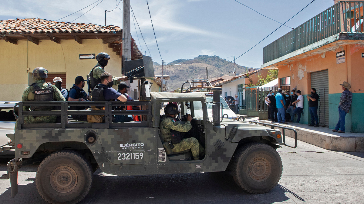 Soldiers patrol for cartel