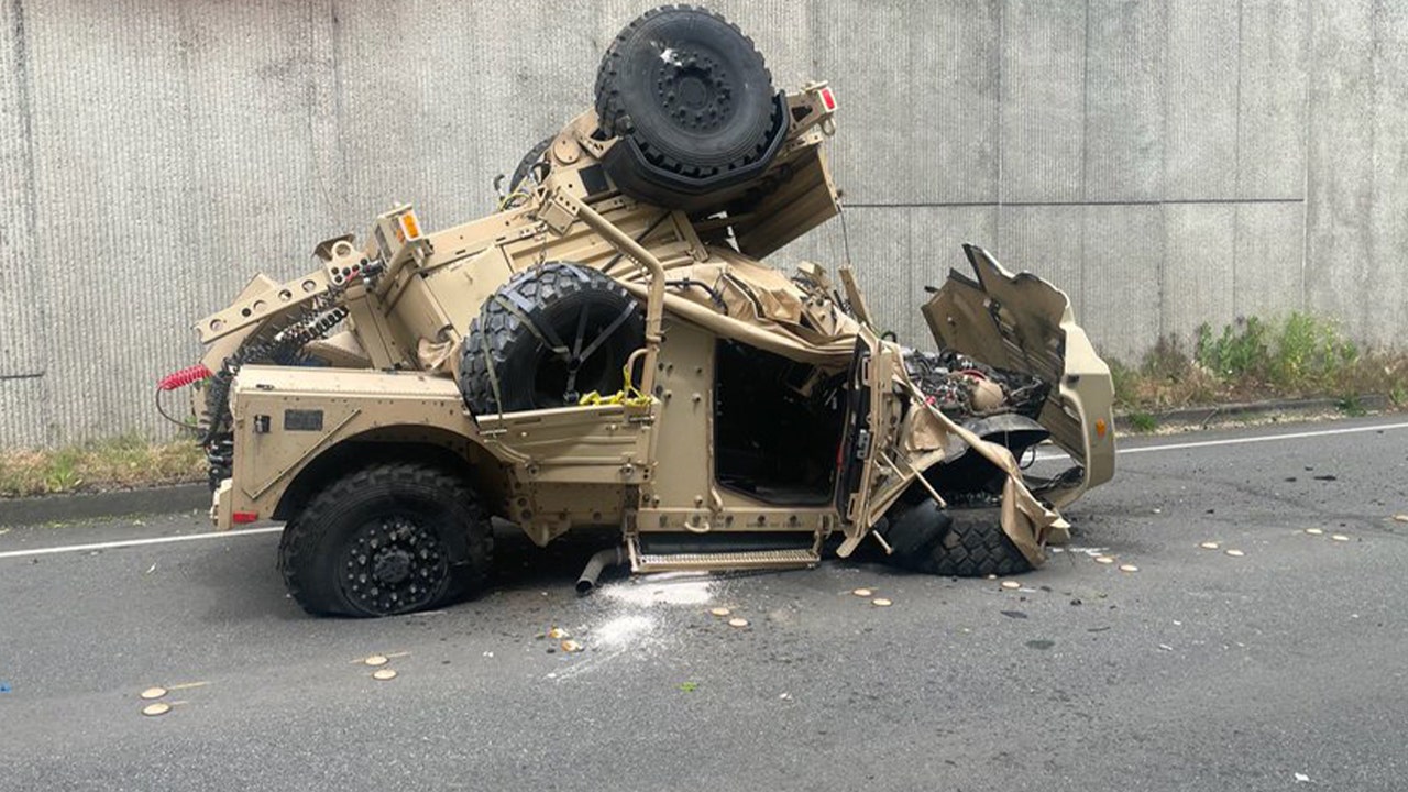 Two injured after military vehicle crashes over highway retaining wall, plunges 30 feet onto road below