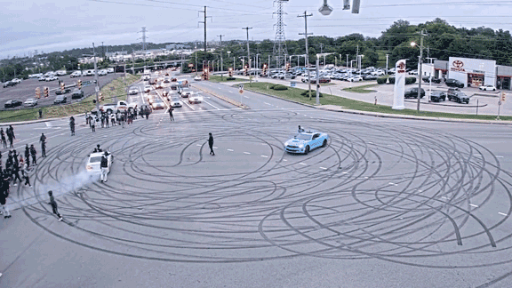 Illegal street takeover shuts down busy intersection with dangerous stunts, fireworks: police